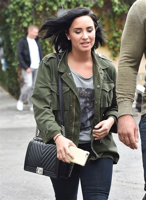 demi lovato chanel bag|A behind.